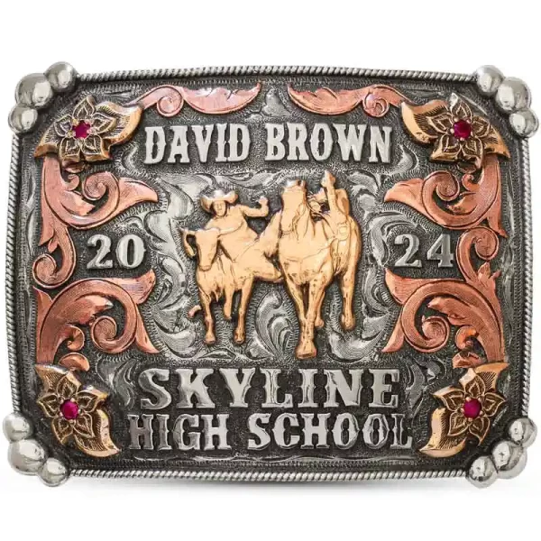 The Austin Belt Buckle is a custom rodeo belt buckle detailed with copper scrolls and flowers. Personalize it with your name and a golden bronze cowboy figure for a fancy standout piece for your graduation!